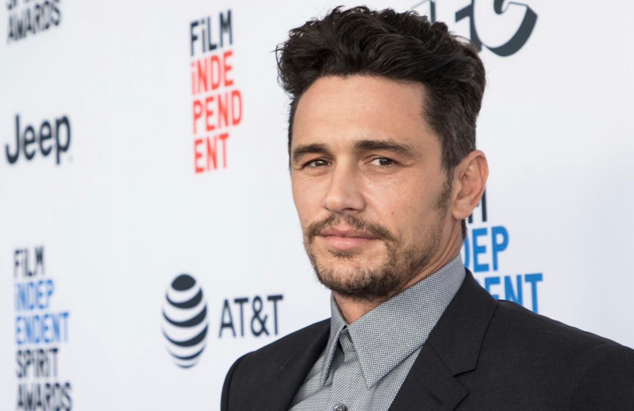 Dave Franco speaking at a promotional event for The Studio in Los Angeles.