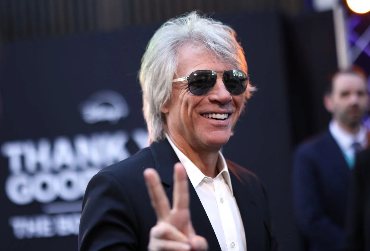 Jon Bon Jovi live concert performance, spotlight on singer.