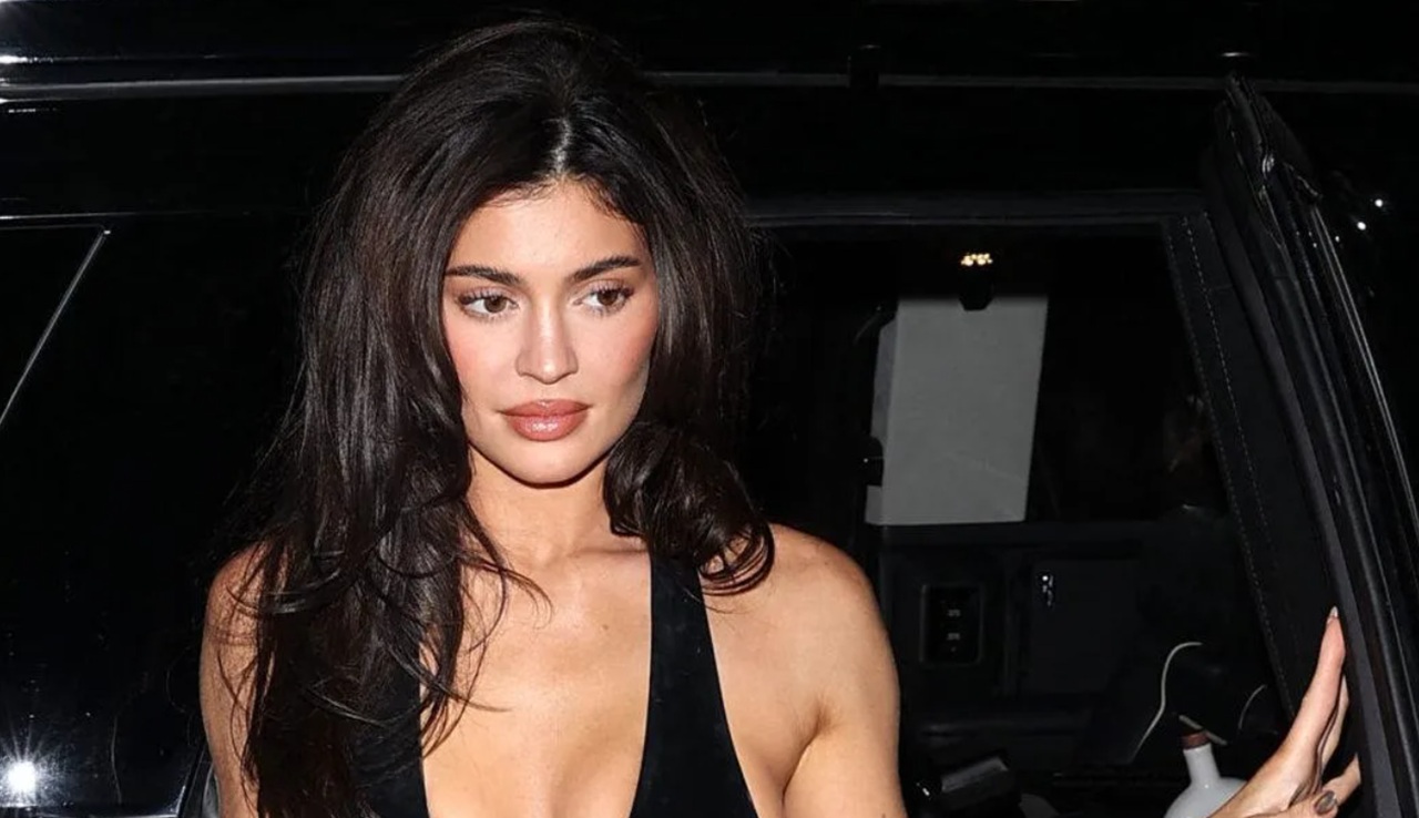 Kylie Jenner holding Norman, her Italian greyhound, in a heartfelt moment.