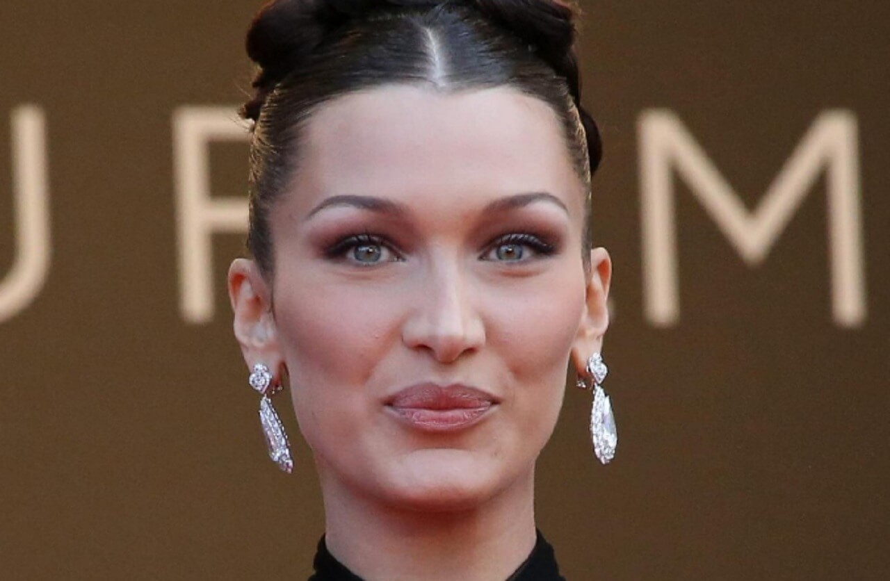 Bella Hadid walking the Saint Laurent runway in Paris, shortly after revealing her chronic illness struggles.