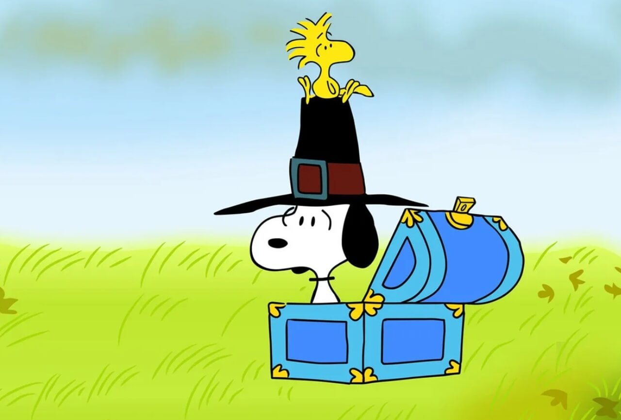 Charlie Brown and Snoopy hosting Thanksgiving dinner in a scene from “A Charlie Brown Thanksgiving.”
