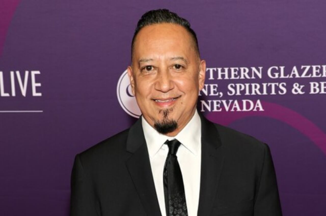 Cleto Escobedo III playing saxophone on Jimmy Kimmel Live! stage