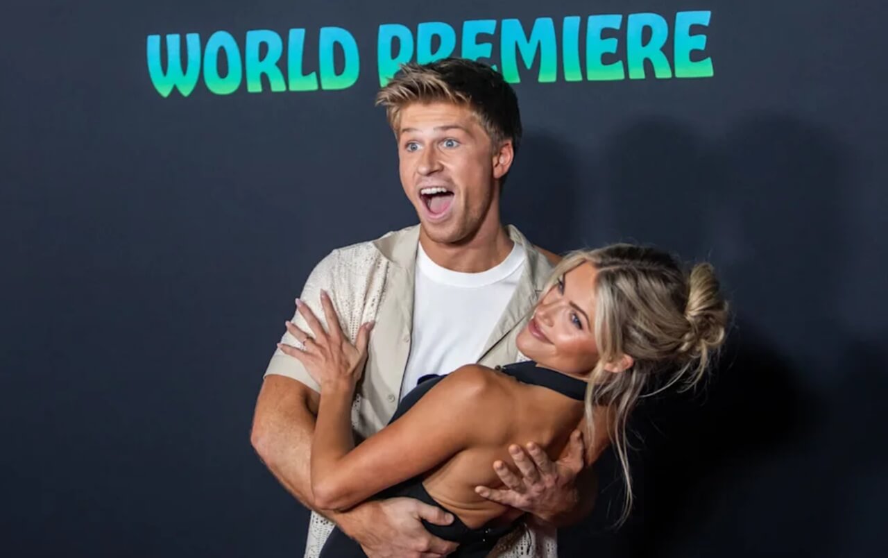 Robert Irwin and Witney Carson pose together smiling at the red carpet premiere of Zootopia 2 in Los Angeles, November 2025.