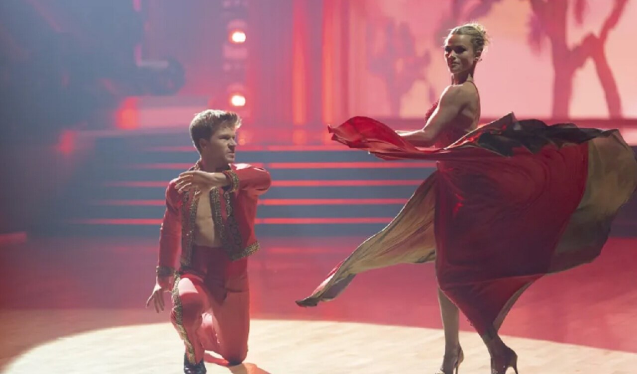Danielle Fishel and Pasha Pashkov dancing on DWTS stage.