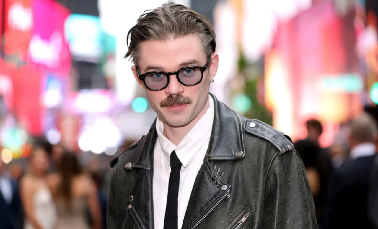 Dom Dolla holding ARIA Global Impact Award trophy on stage after record-breaking year.