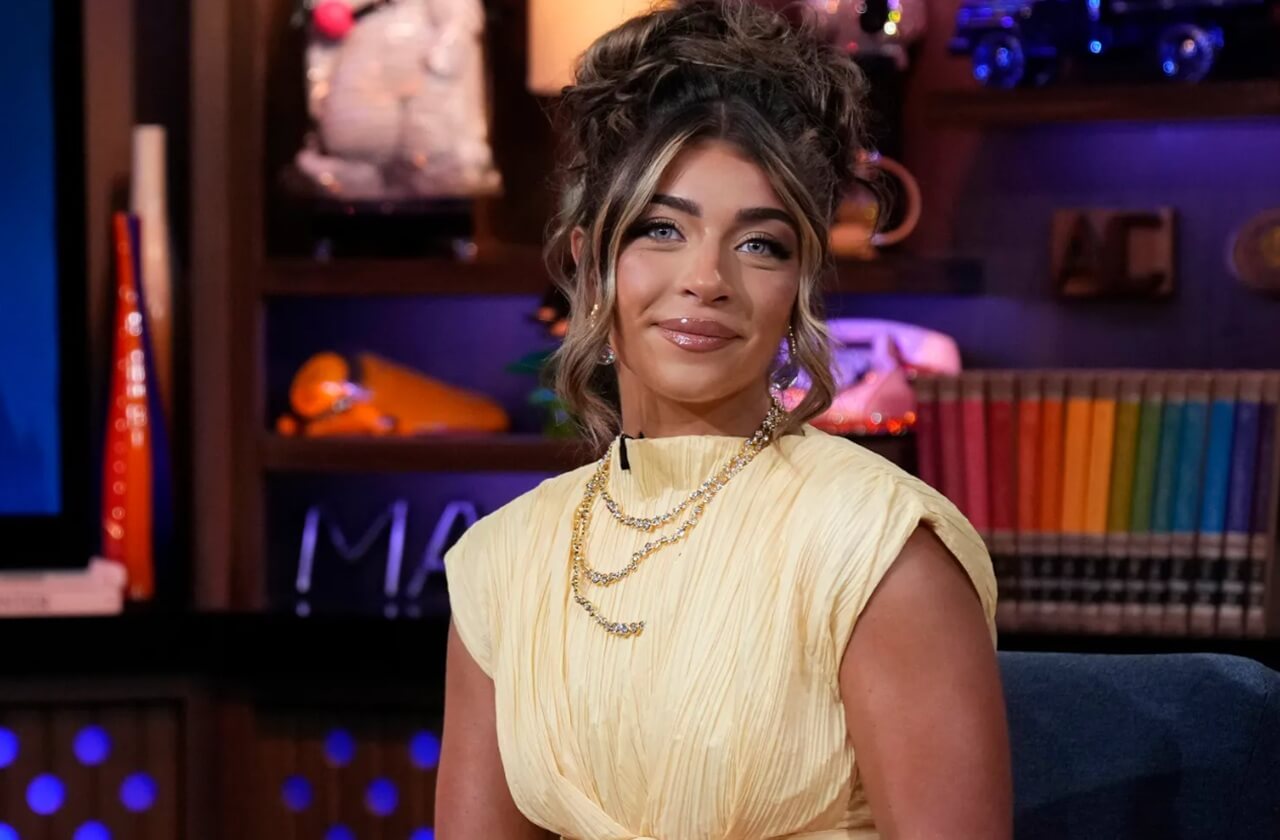 Gia Giudice speaks into a microphone during her podcast episode addressing marriage rumors.