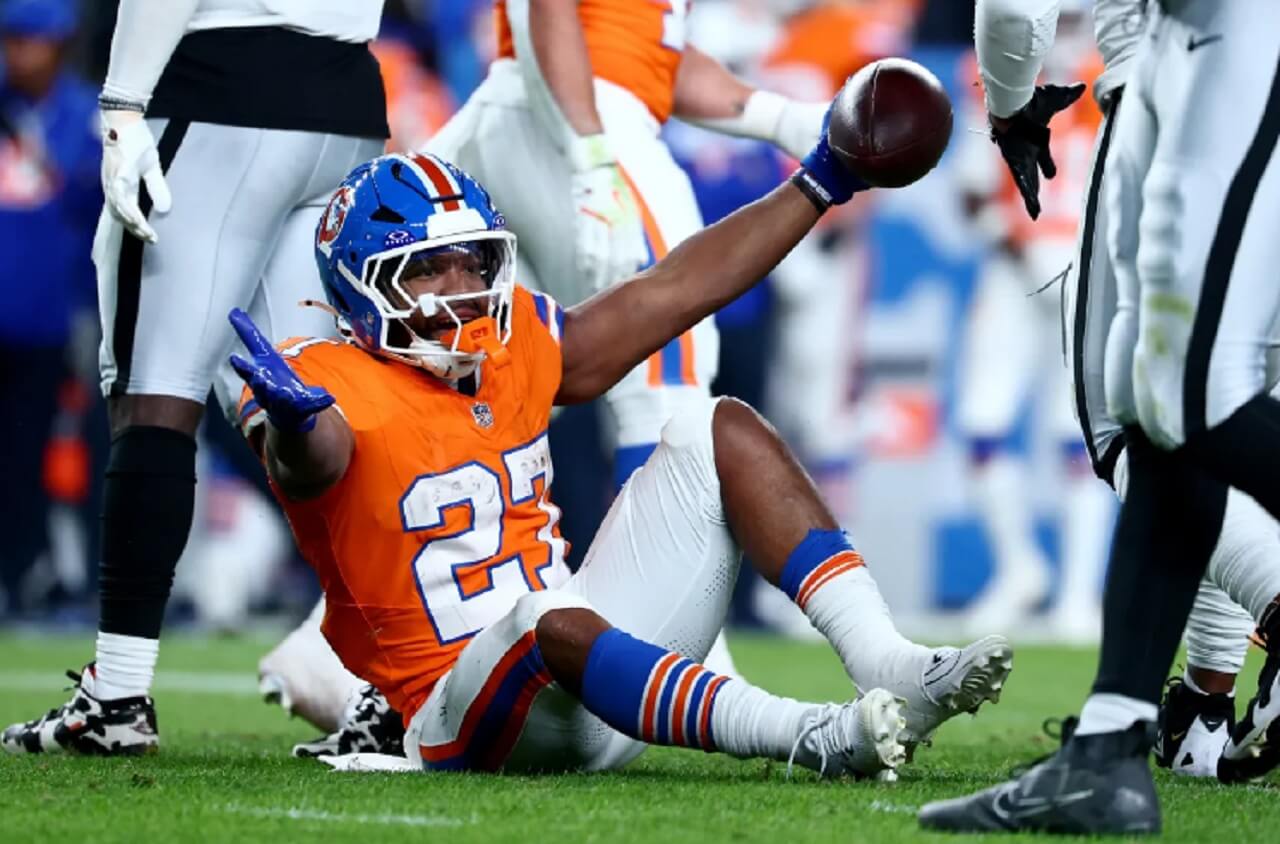 Denver Broncos running back J.K. Dobbins in uniform, sidelined after shocking season-ending foot injury.