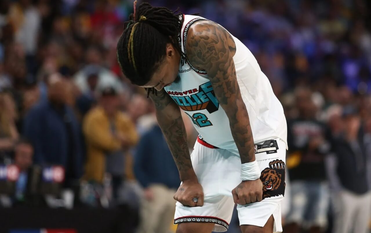Ja Morant dribbling during a Memphis Grizzlies game, cleared to play after ankle injury update.”