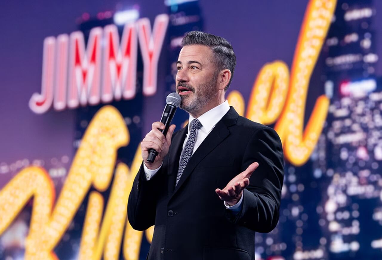 Jimmy Kimmel at the Jimmy Kimmel Live! stage microphone during a live show.