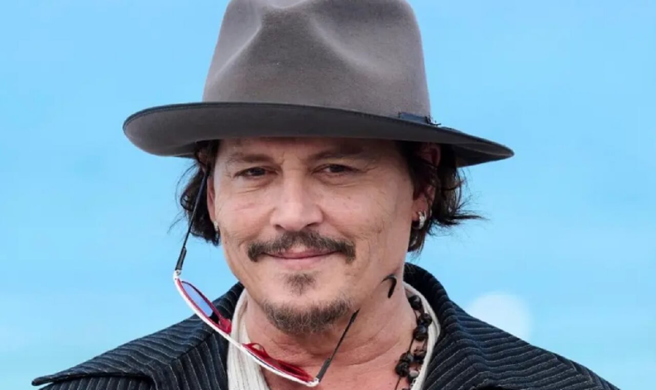 Johnny Depp smiles while speaking about his daughter Lily-Rose Depp’s bold role in HBO’s The Idol.