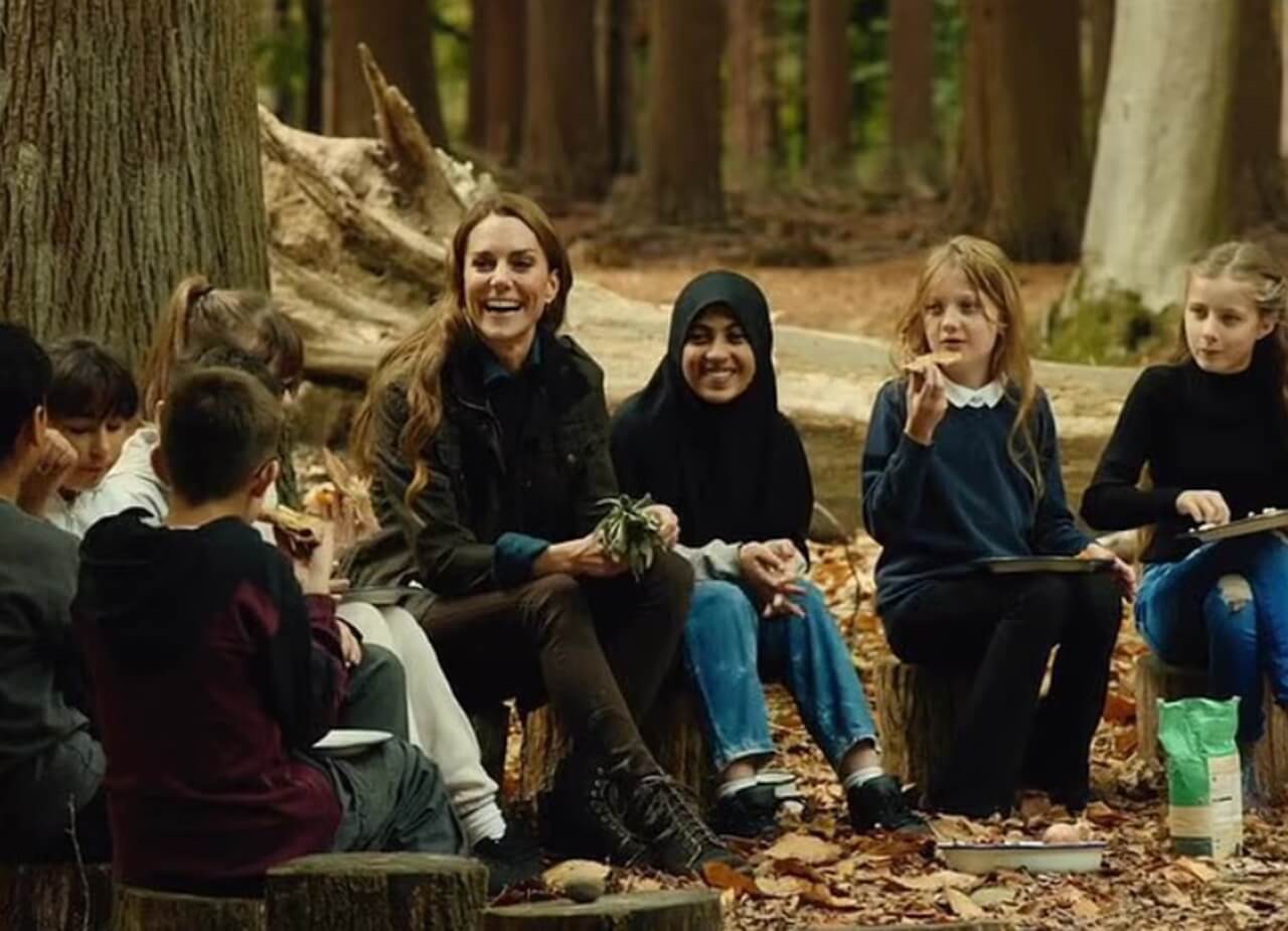 Kate Middleton baking bread with kids outdoors in fall.