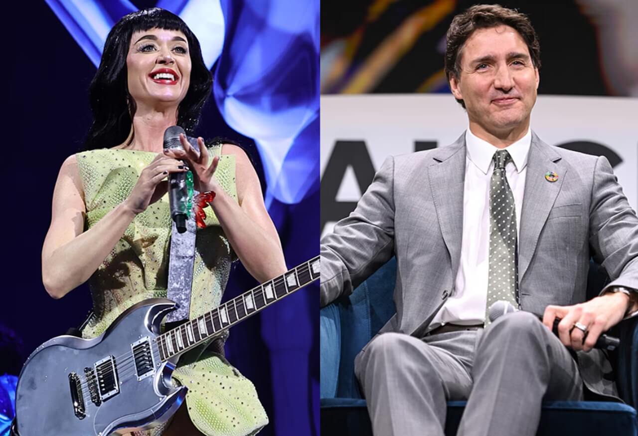 Katy Perry wearing a quirky Thanksgiving feast hat featuring a turkey and holiday foods.