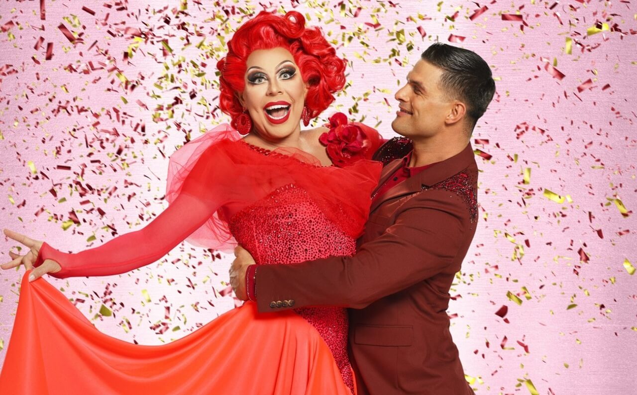 Strictly contestant La Voix in costume posing backstage.