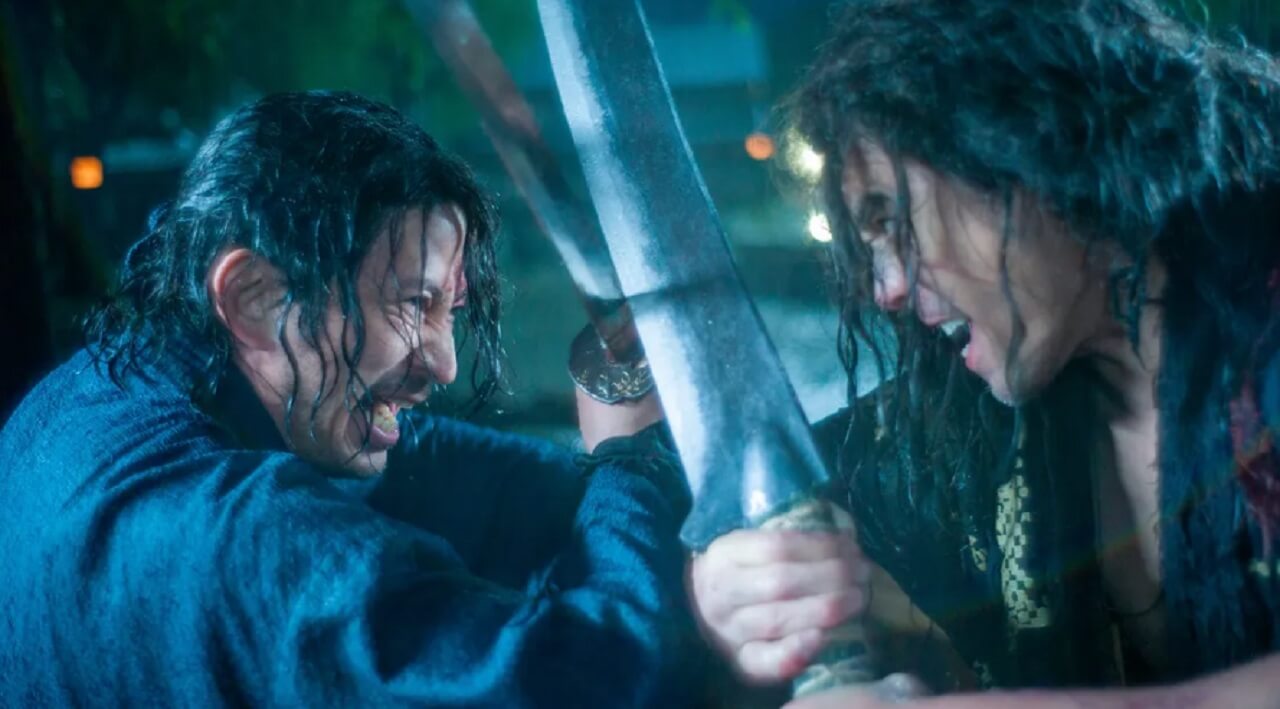 Junichi Okada as Shujiro Saga in Netflix’s Last Samurai Standing, wielding a sword in a brutal battle scene.