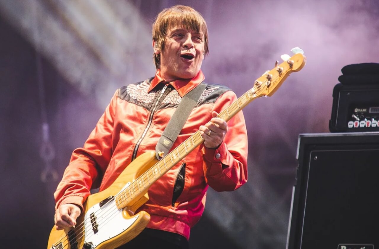 Mani performing live with the Stone Roses.