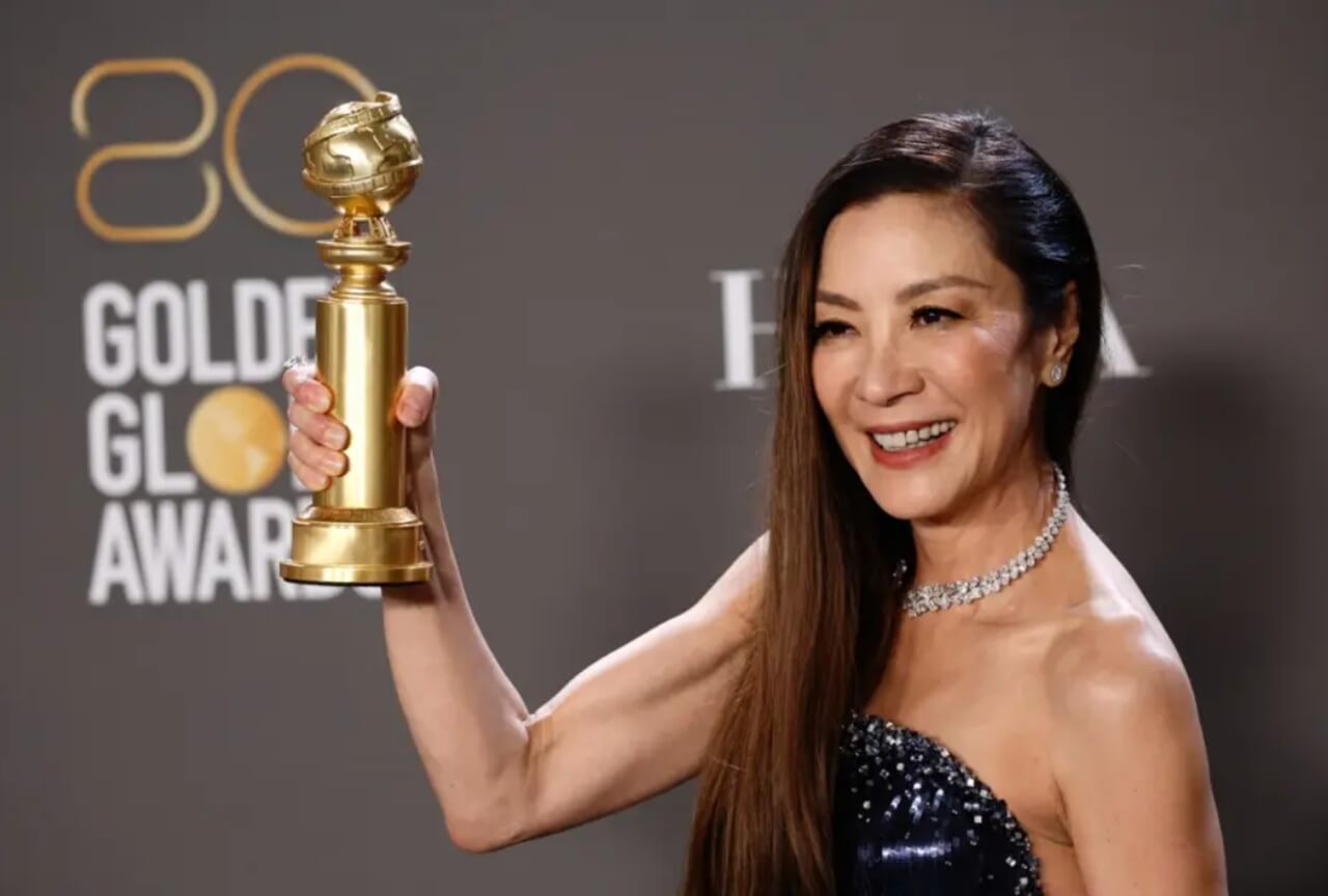 Michelle Yeoh smiling at a film festival red carpet