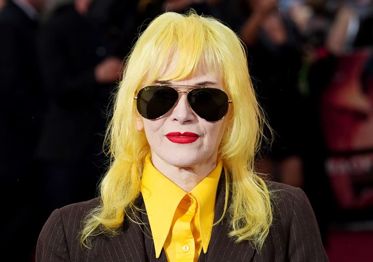 Fashion designer Pam Hogg at a runway show wearing signature avant-garde styling.