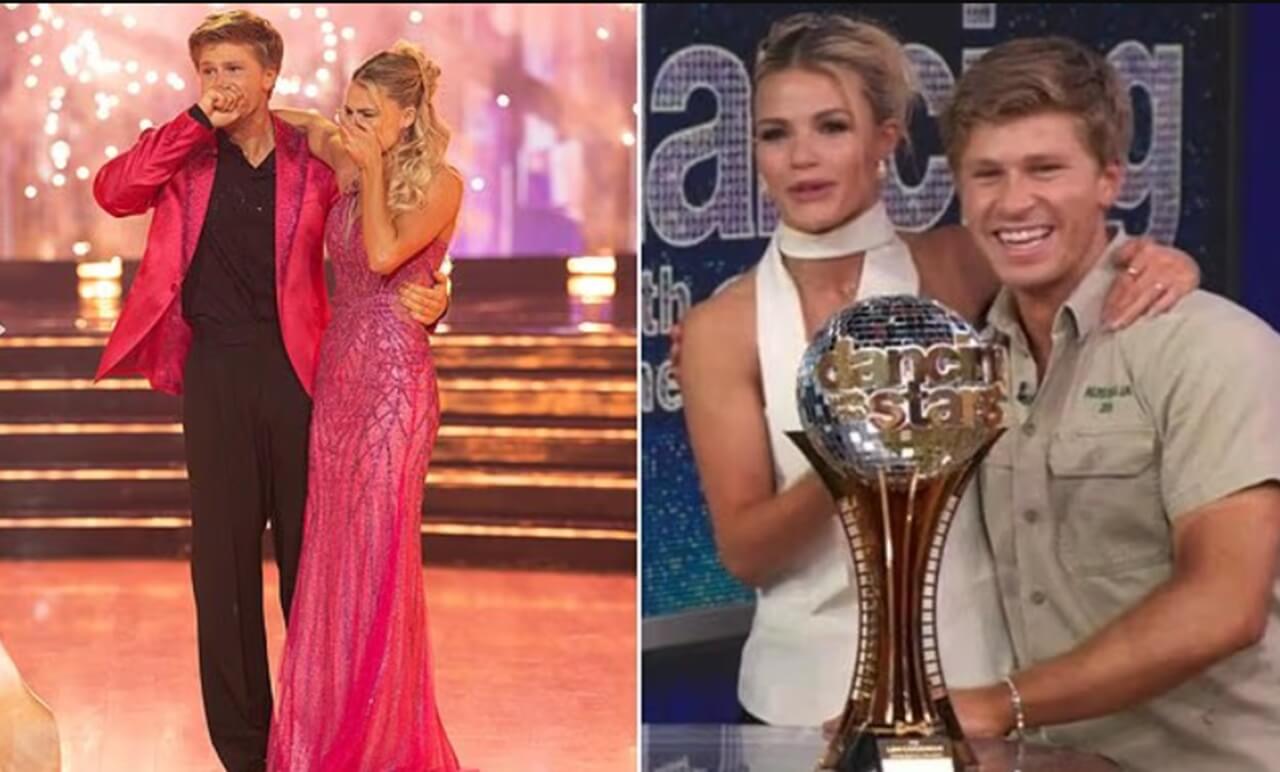 Robert Irwin and Witney Carson celebrate with the Mirrorball Trophy after winning the Dancing with the Stars Season 34 finale.