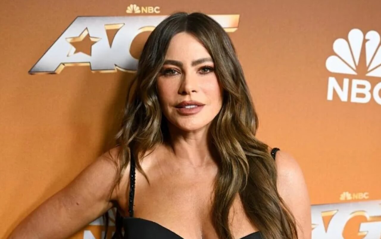 Sofia Vergara in black lace top and leather skirt at night in Miami.