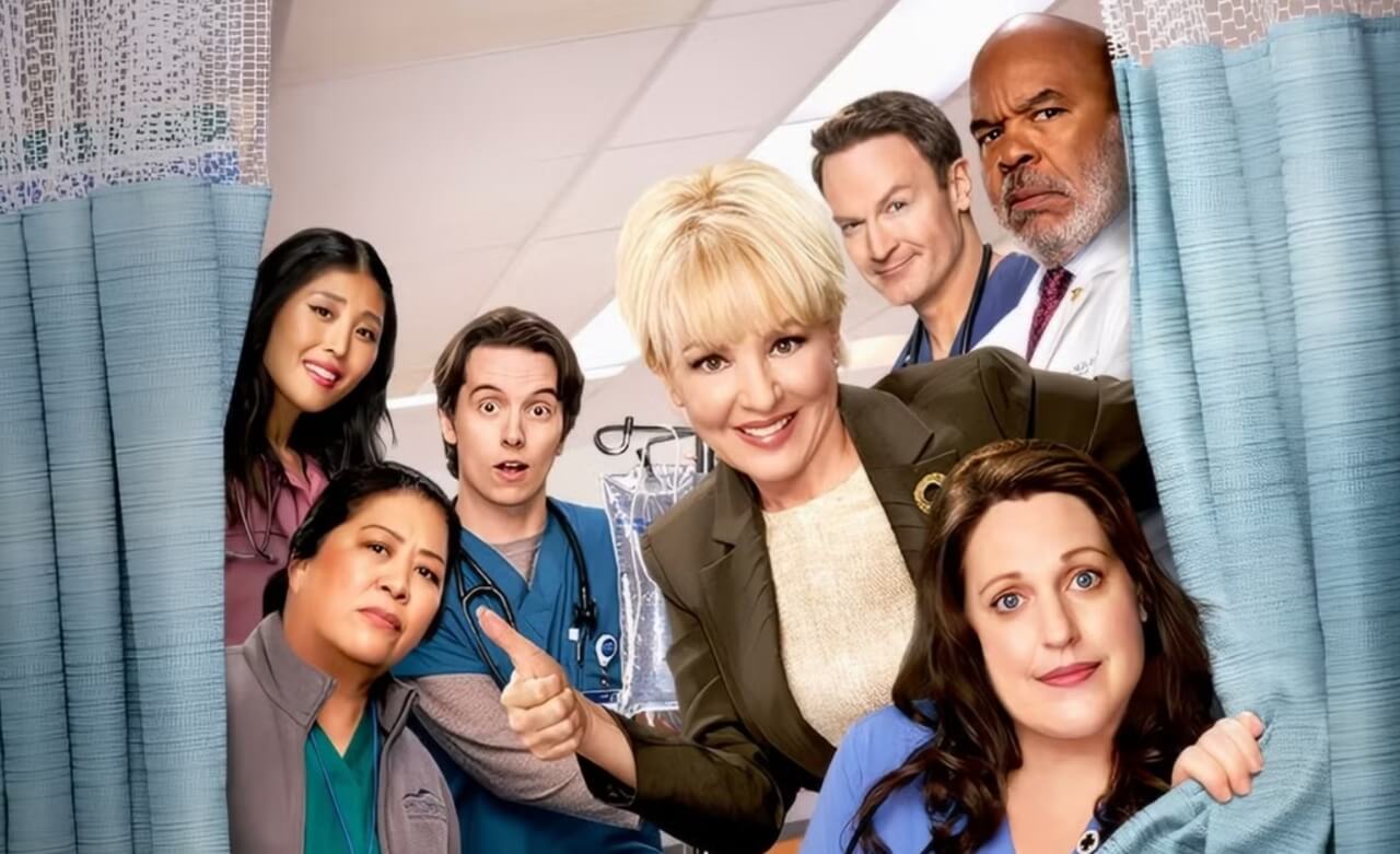 St. Denis Medical Season 2 cast in hospital hallway scene.