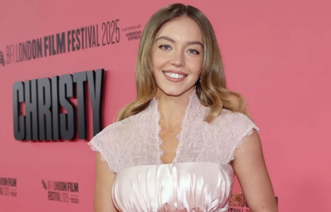 Sydney Sweeney attends film event in black gown.