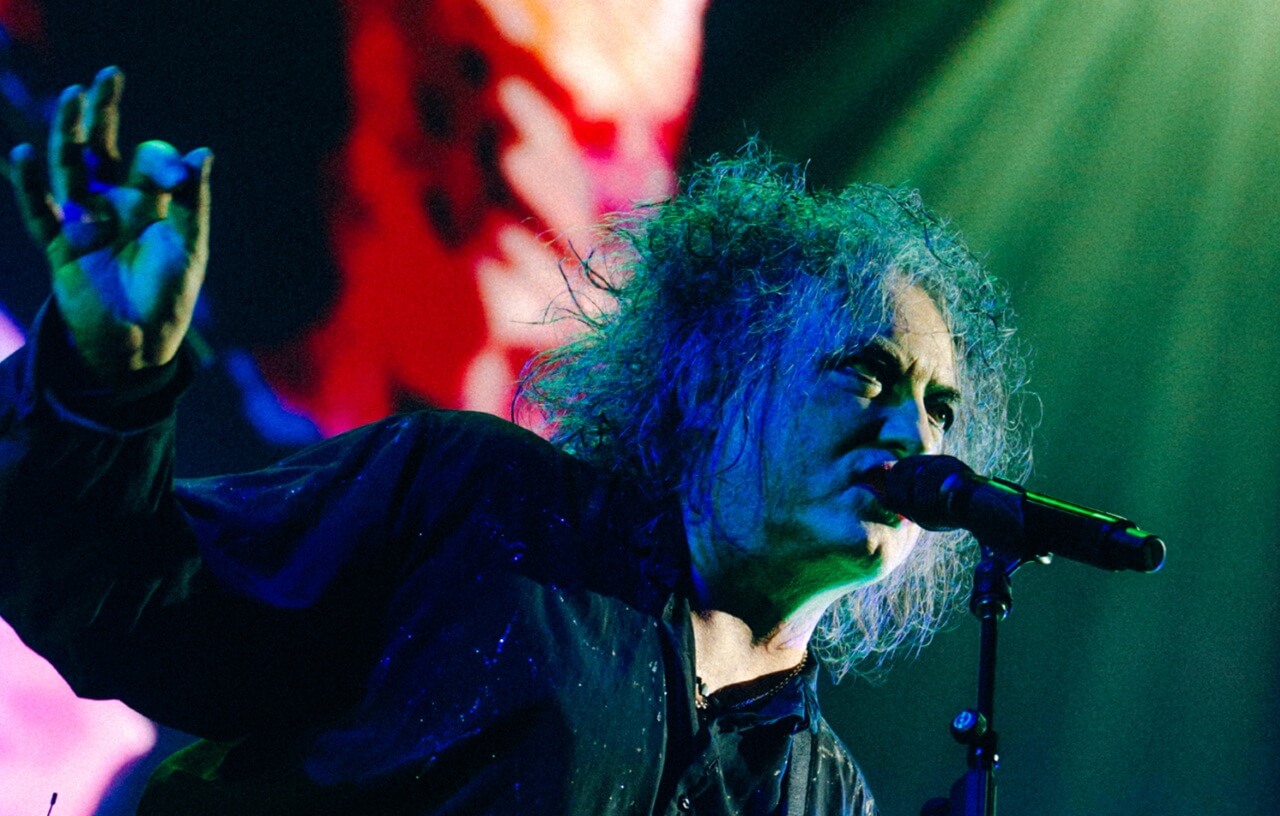 Robert Smith performing at The Cure’s “The Show of a Lost World” concert film.