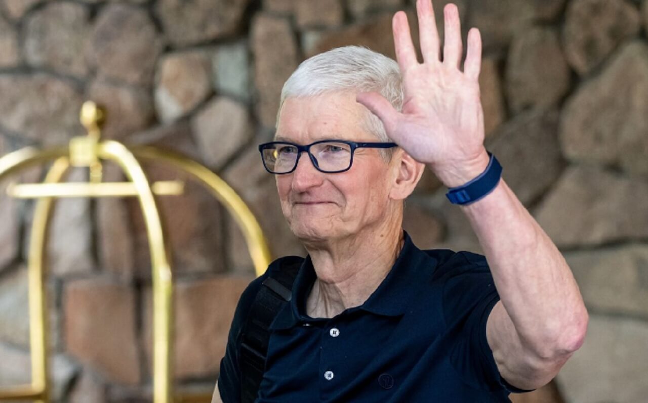 Apple CEO Tim Cook speaking at a product launch event, amid reports of his shocking potential exit in 2025.
