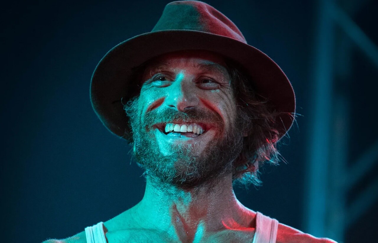 Todd Snider performing acoustic guitar in Nashville.