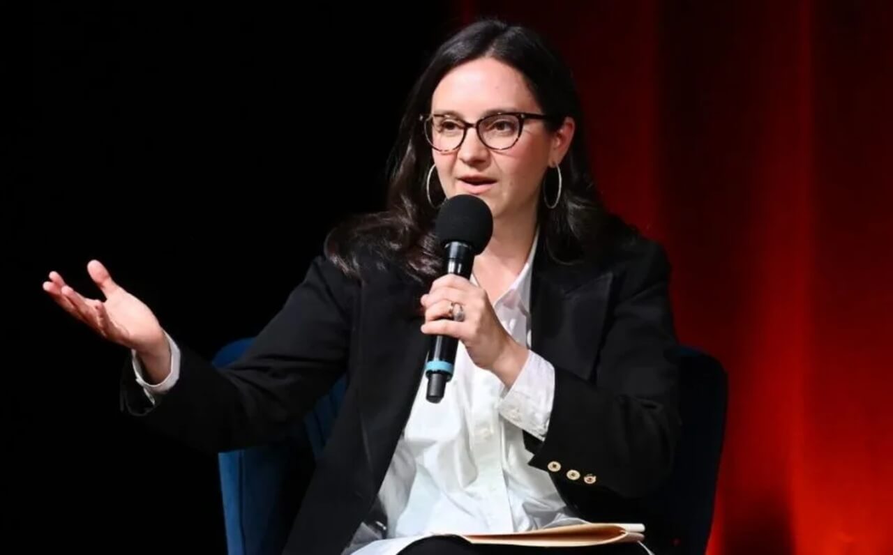 Bari Weiss addressing an audience during a live media event.