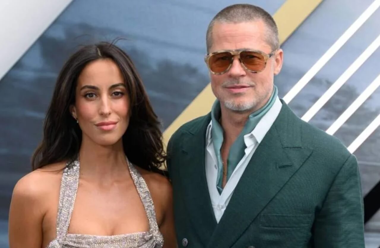 Brad Pitt and Ines de Ramon attend an event together, smiling.
