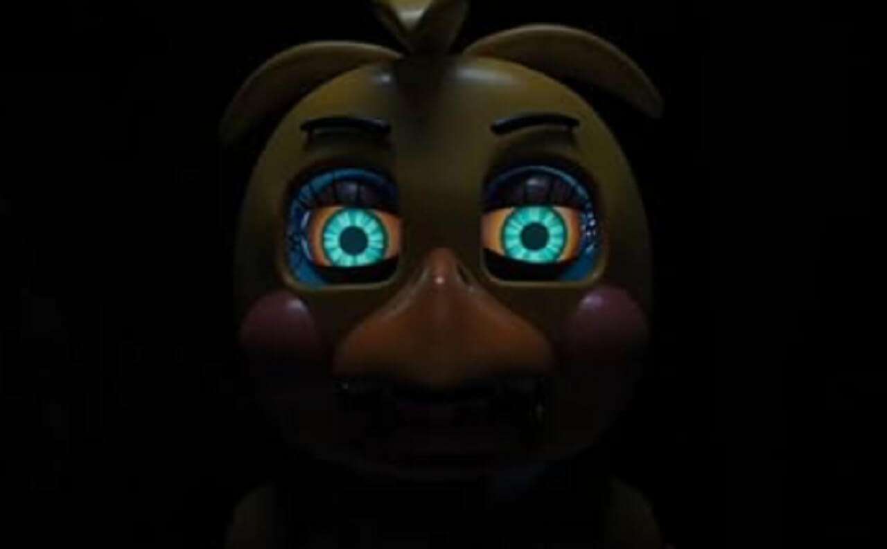 Fans gather near a theater poster for Five Nights at Freddy’s 2 on opening weekend.