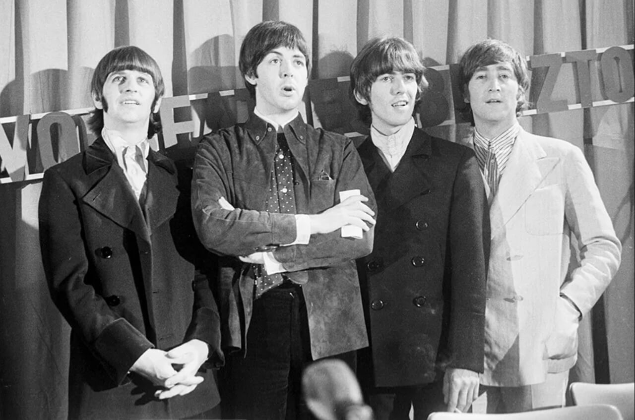 Early-era Beatles performing live in a Hamburg club environment.