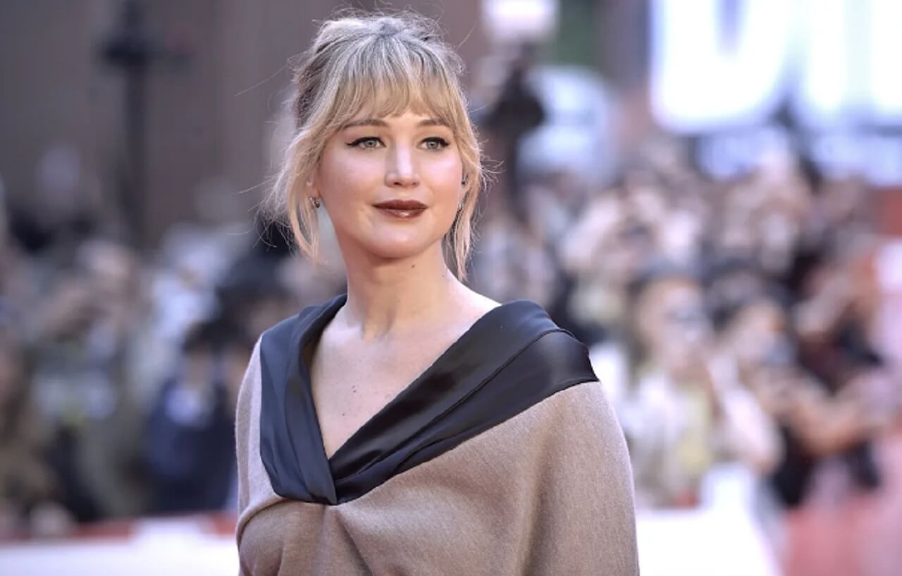 Jennifer Lawrence discussing motherhood and postpartum depression during a podcast interview.