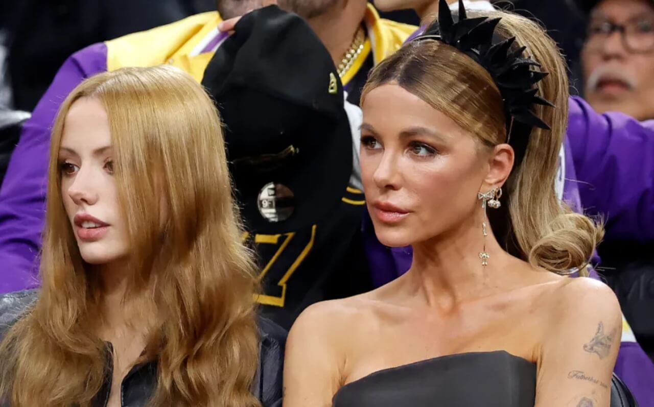 Kate Beckinsale in strapless dress and platform boots courtside at NBA game