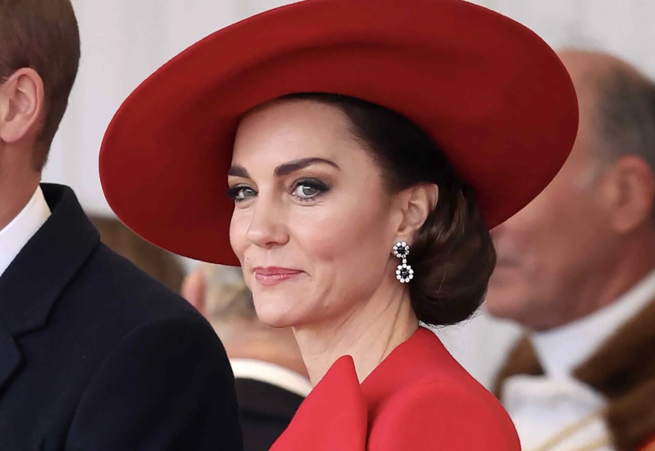 Kate Middleton wearing a classic royal outfit at a formal event