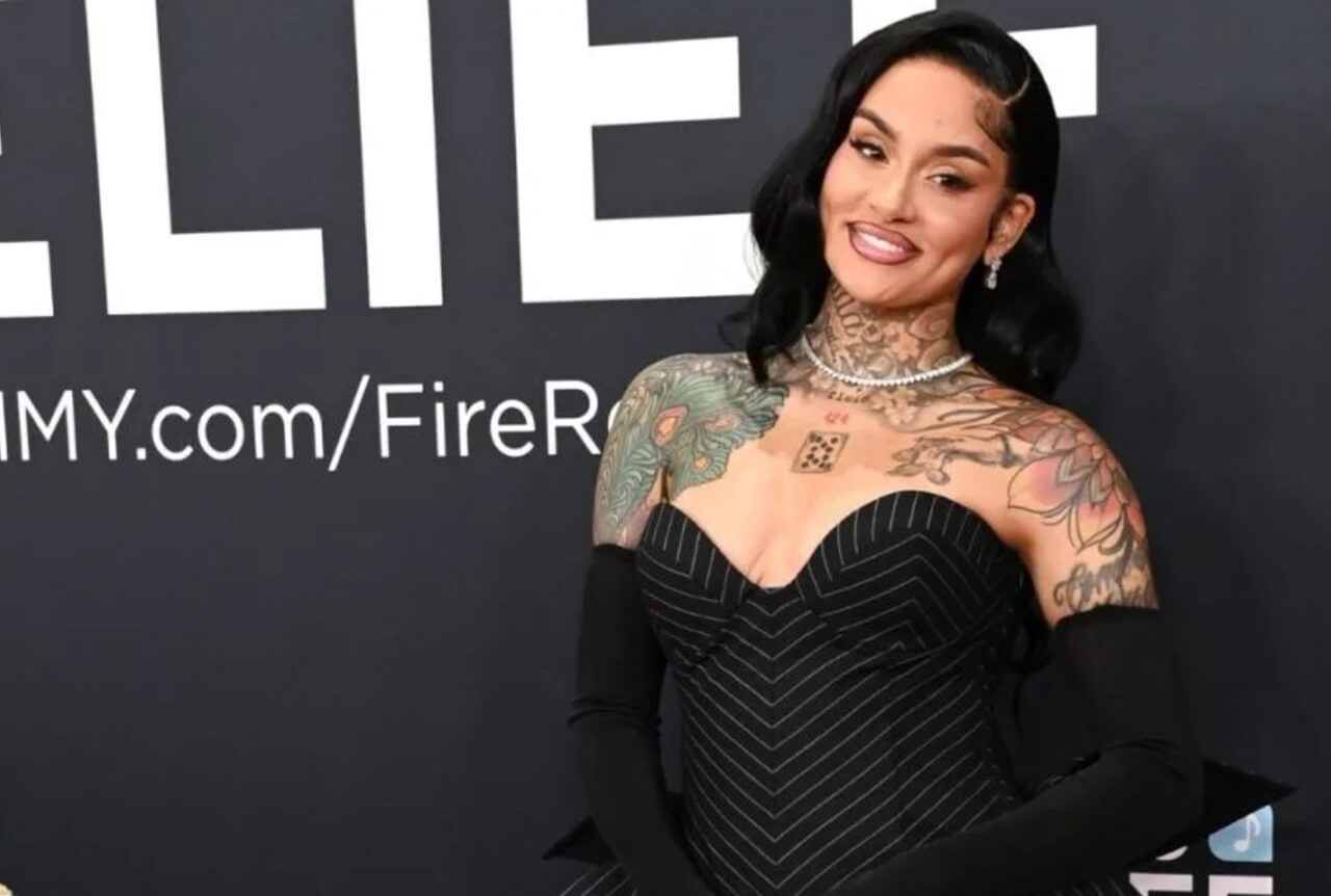 “Kehlani performs at the Grammy Museum wearing bold cut-out black dress.”