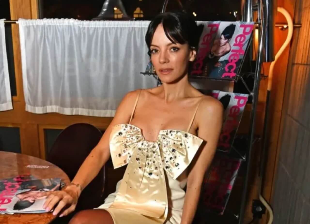 Lily Allen singing on stage while announcing her 2026 North American tour.