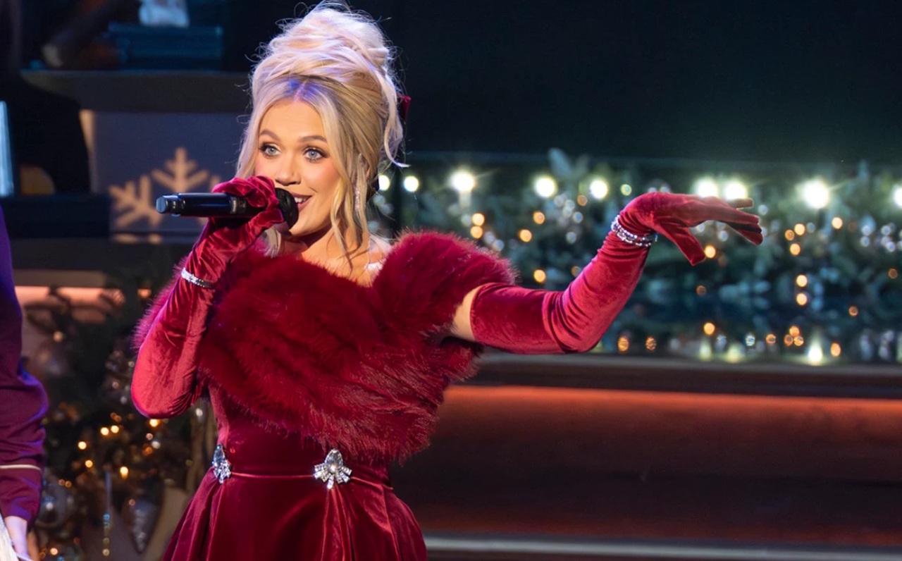 Megan Moroney poses in festive red velvet dress for CMA Country Christmas special.