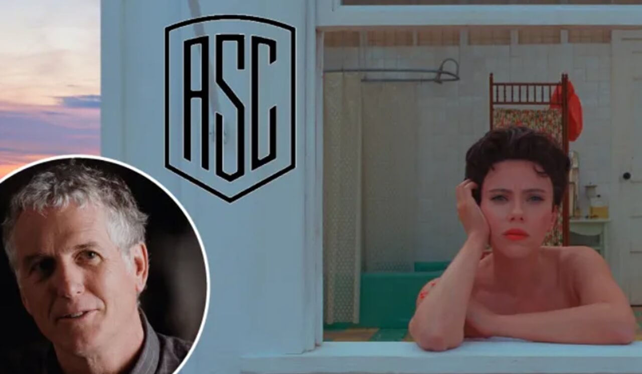 Cinematographer Robert Yeoman working behind the camera on a film set.