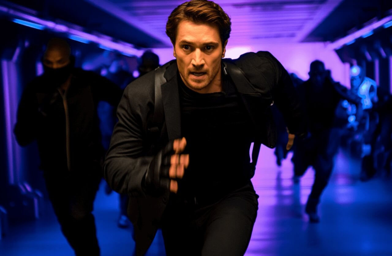 Glen Powell in The Running Man 2025 dystopian action scene