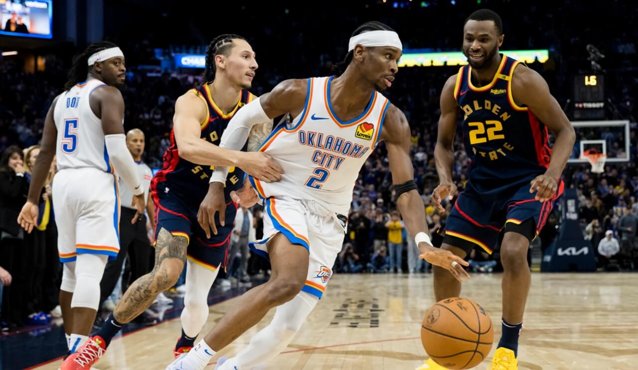 Thunder players celebrate during game against Warriors at Chase Center.