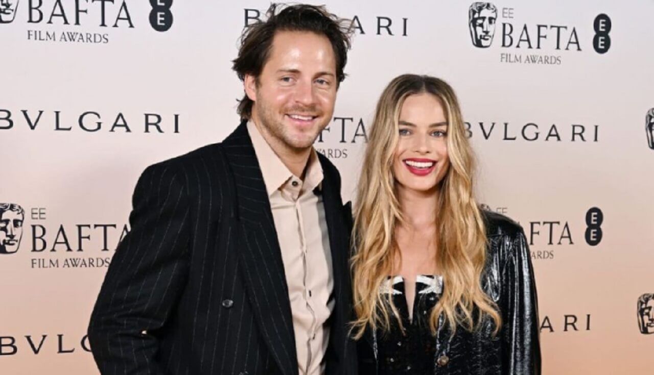 Tom Ackerley and Margot Robbie attend a Hollywood premiere together.