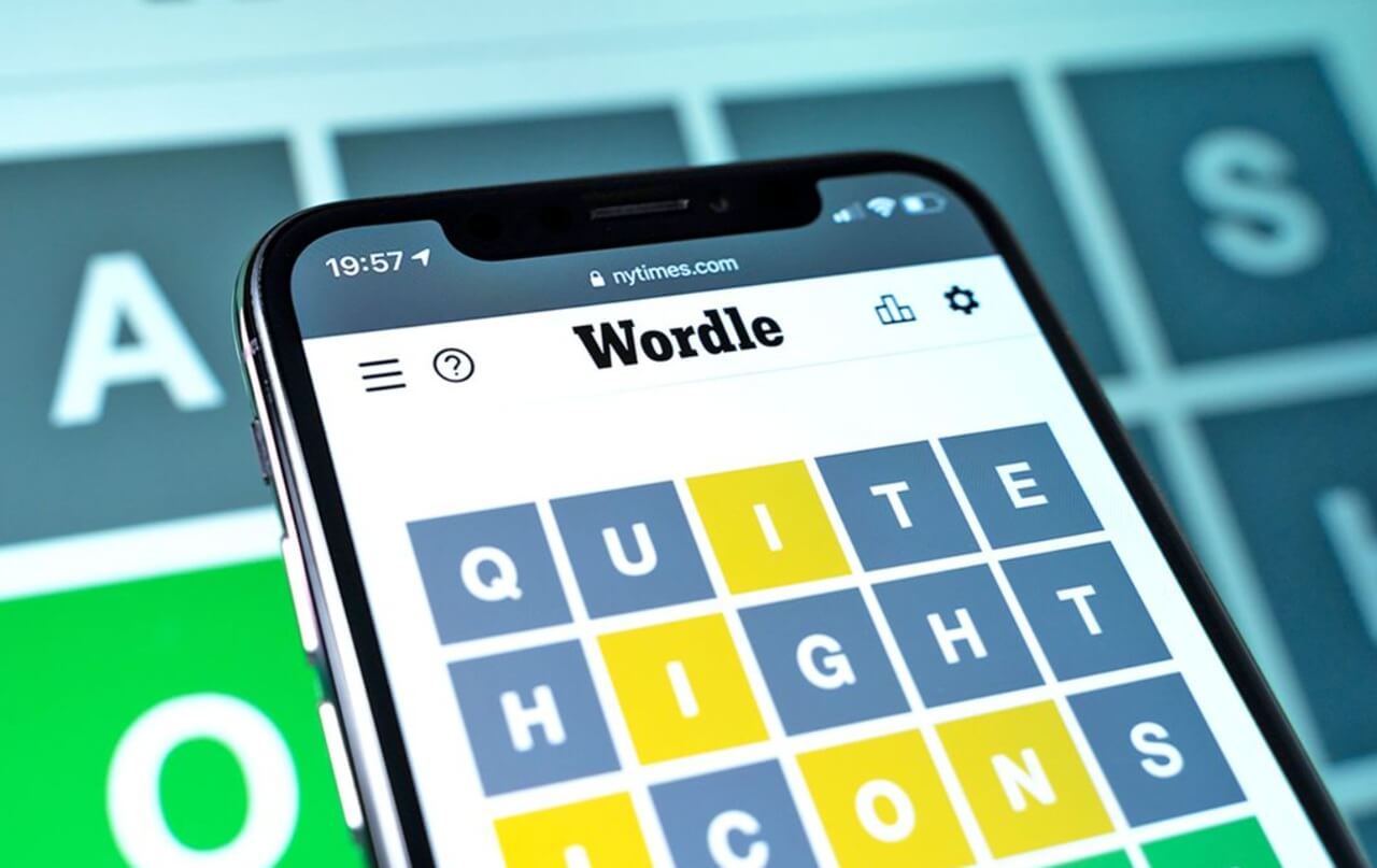 Wordle puzzle grid displayed on a mobile screen with colored letter tiles indicating correct and incorrect guesses.