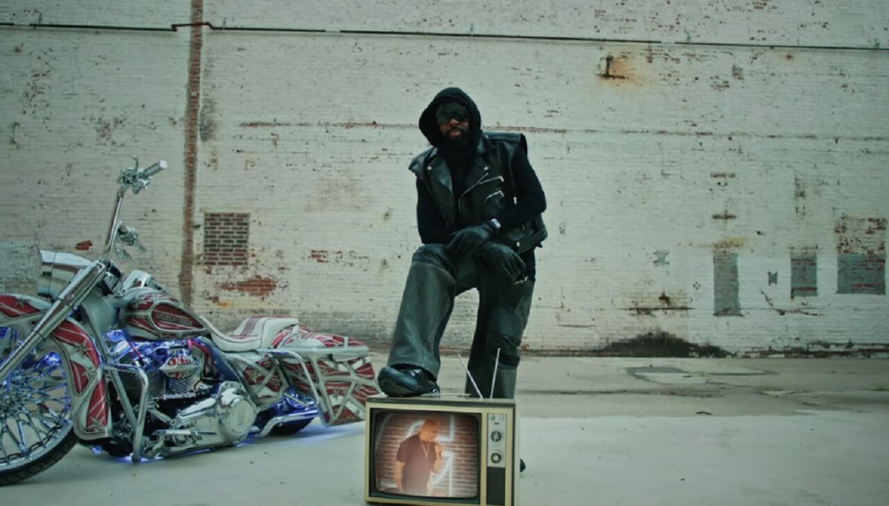 Wyclef Jean and director Tasha Smith collaborating on the ‘Back From Abu Dhabi’ music video.