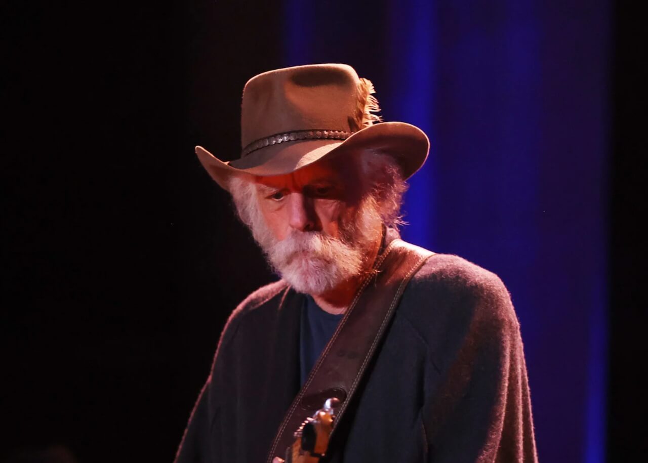 Billy Strings honoring Bob Weir during a live performance.