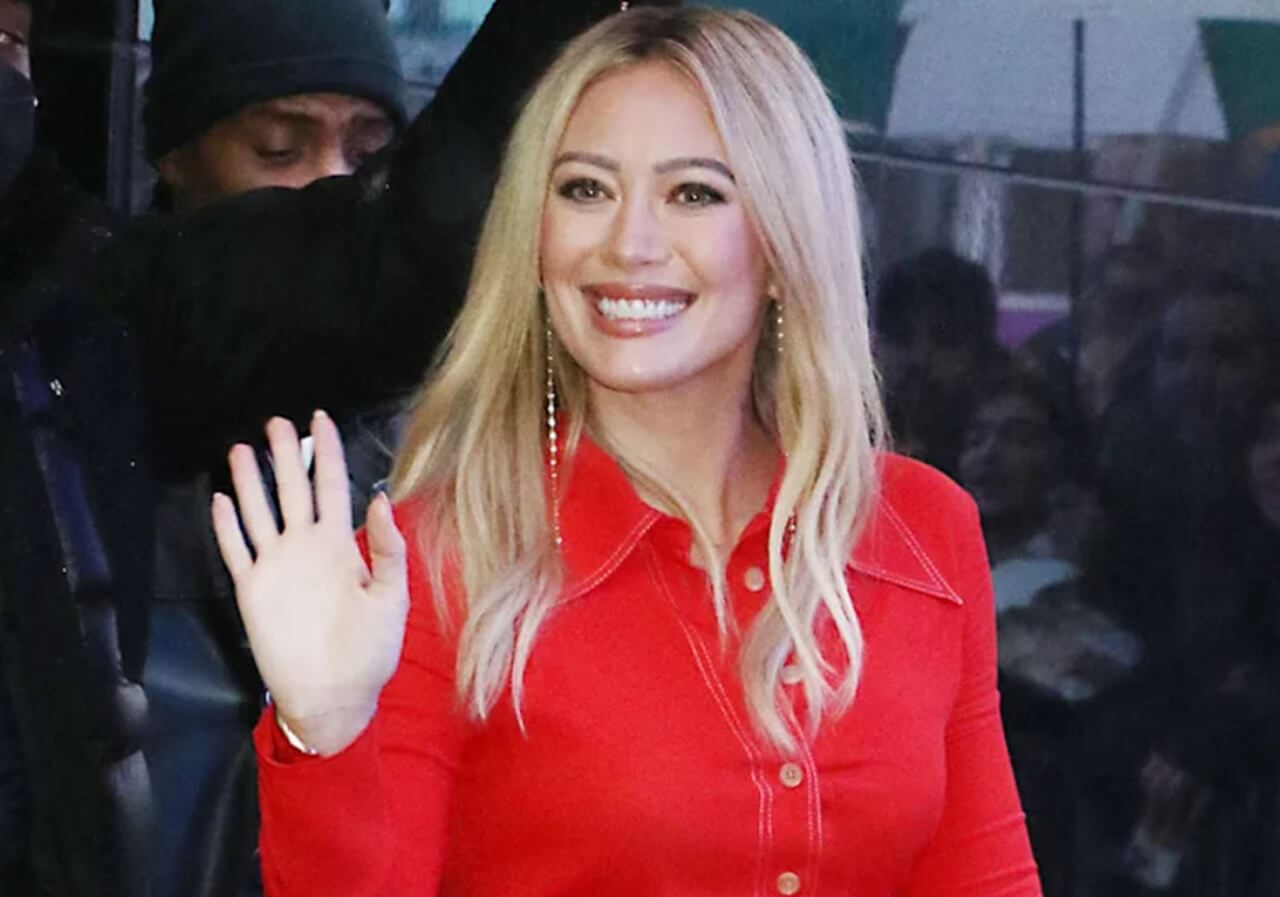 Hilary Duff on stage at The Wiltern, announcing world tour during comeback concert.