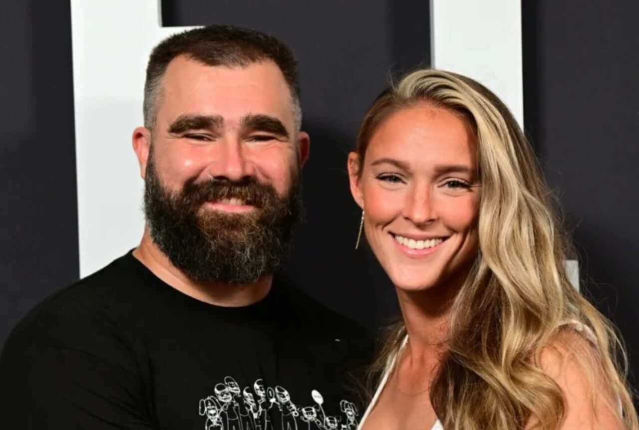 Jason Kelce in a sharp suit at a Prime Video event, praised by wife Kylie for his swag.
