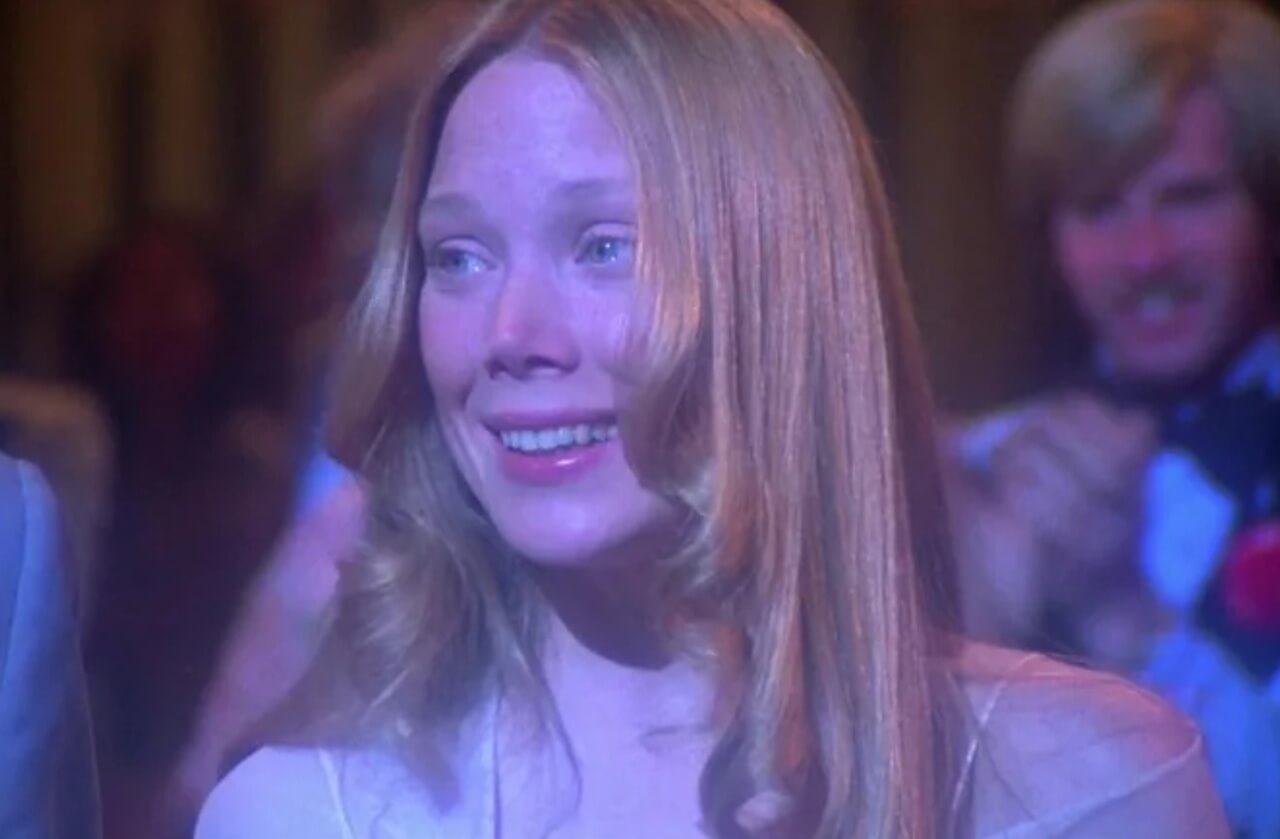 Carrie White from the 1976 film and director Mike Flanagan, highlighting the legacy of Stephen King’s Carrie.