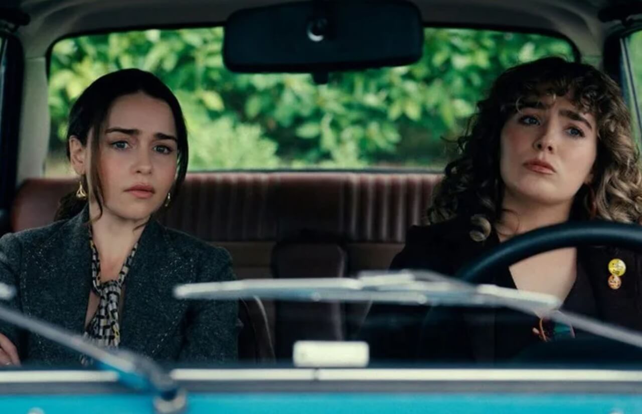 Emilia Clarke and Haley Lu Richardson in Peacock’s PONIES premiere scene.