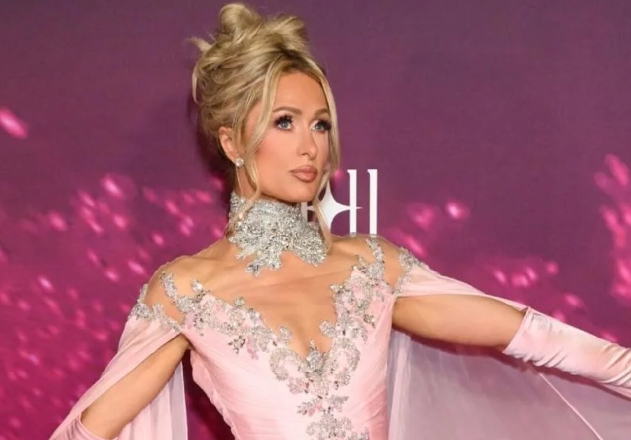 Paris Hilton stuns in a blush pink sheer gown with high slit at documentary premiere.